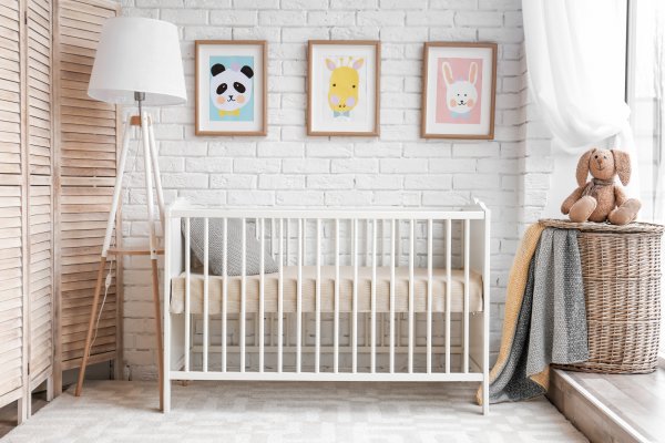 Baby crib side view in a room